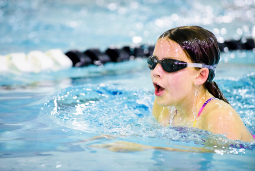 Girl swimming front crawl